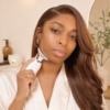 CJAY Beauty model presenting the LED neck and face device