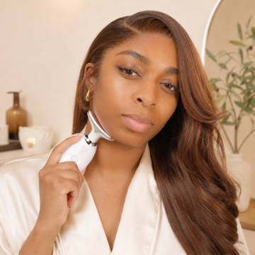 CJAY Beauty model presenting the LED neck and face device